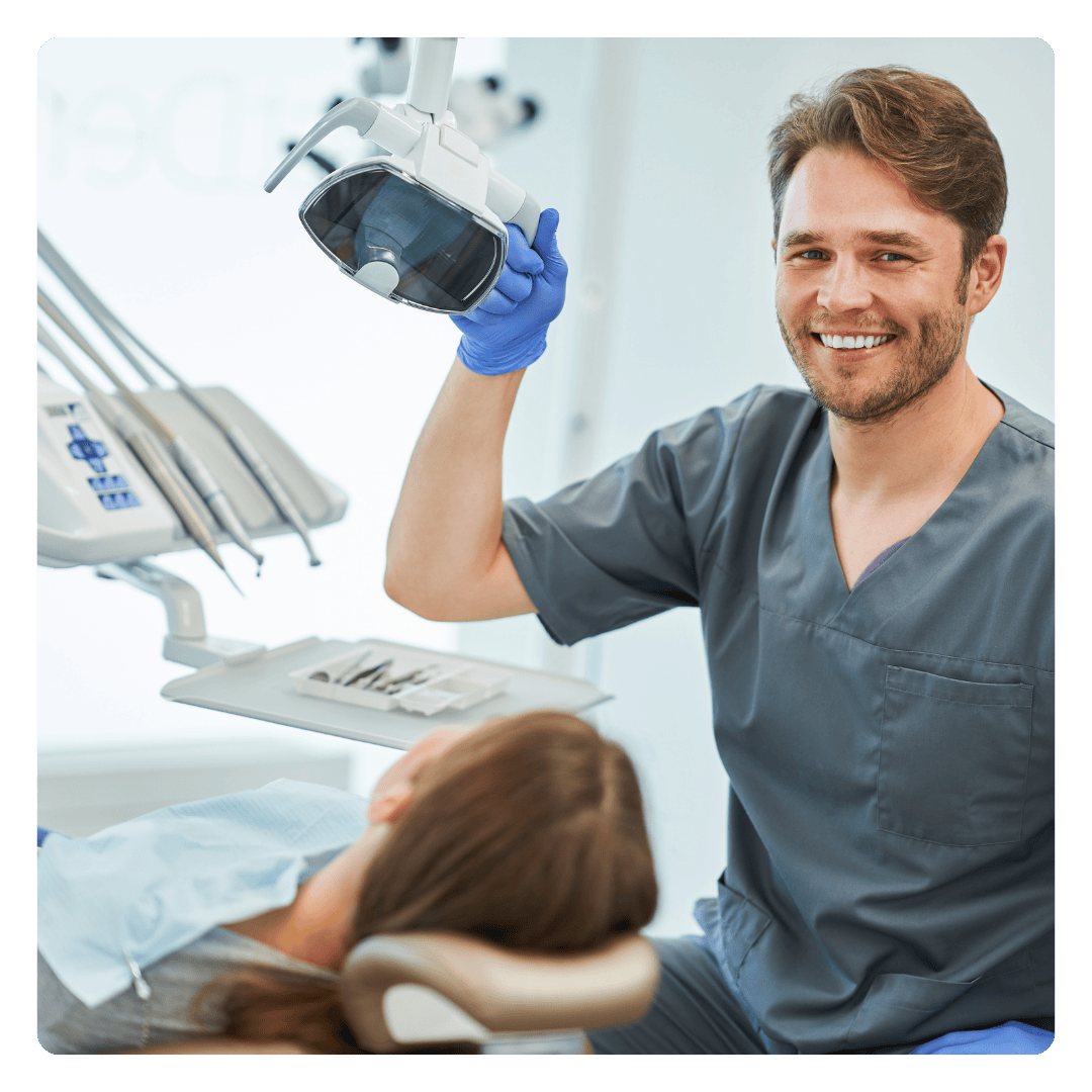 Dentist with patient in chair Dentist with patient in chair